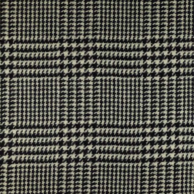 Charcoal and ivory woven check with houndstooth texture in close-up