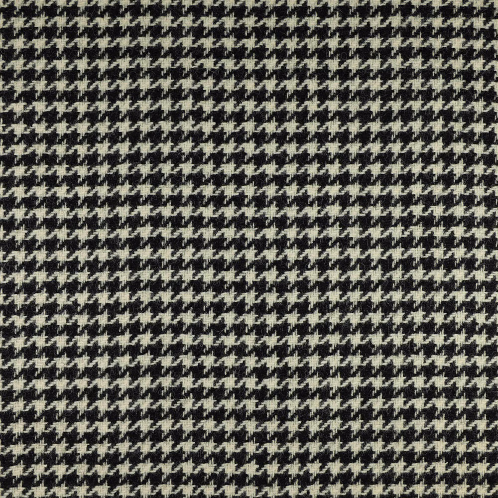 Small cream houndstooth checks over a near-black charcoal woven ground