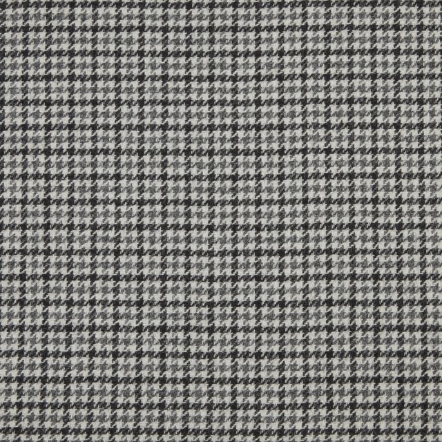 Close-up of cool grey and charcoal small-scale houndstooth woven fabric