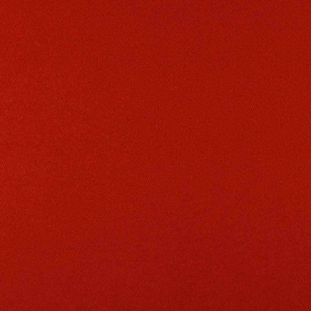 Close-up of deep crimson red fabric with a fine, even woven texture