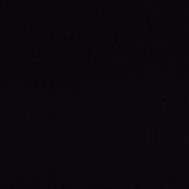 Near-black fabric swatch with a barely visible fine surface grain