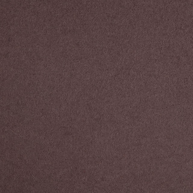 Close-up of muted plum-brown fabric with a soft, finely mottled texture