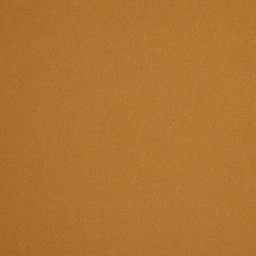 Warm ochre-brown plain fabric with a fine, softly mottled texture