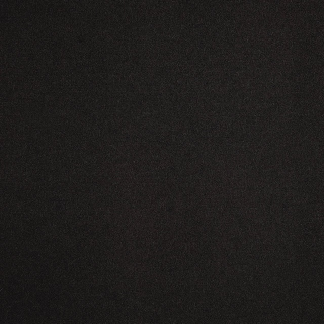 Near-black charcoal textile swatch with faint mottling and a softly textured surface