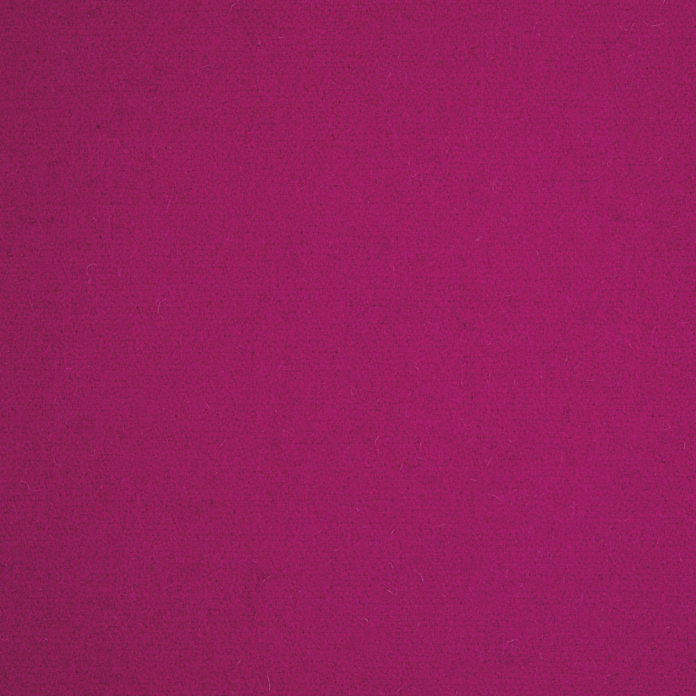 Close-up of saturated magenta textile with a softly mottled, low-sheen surface