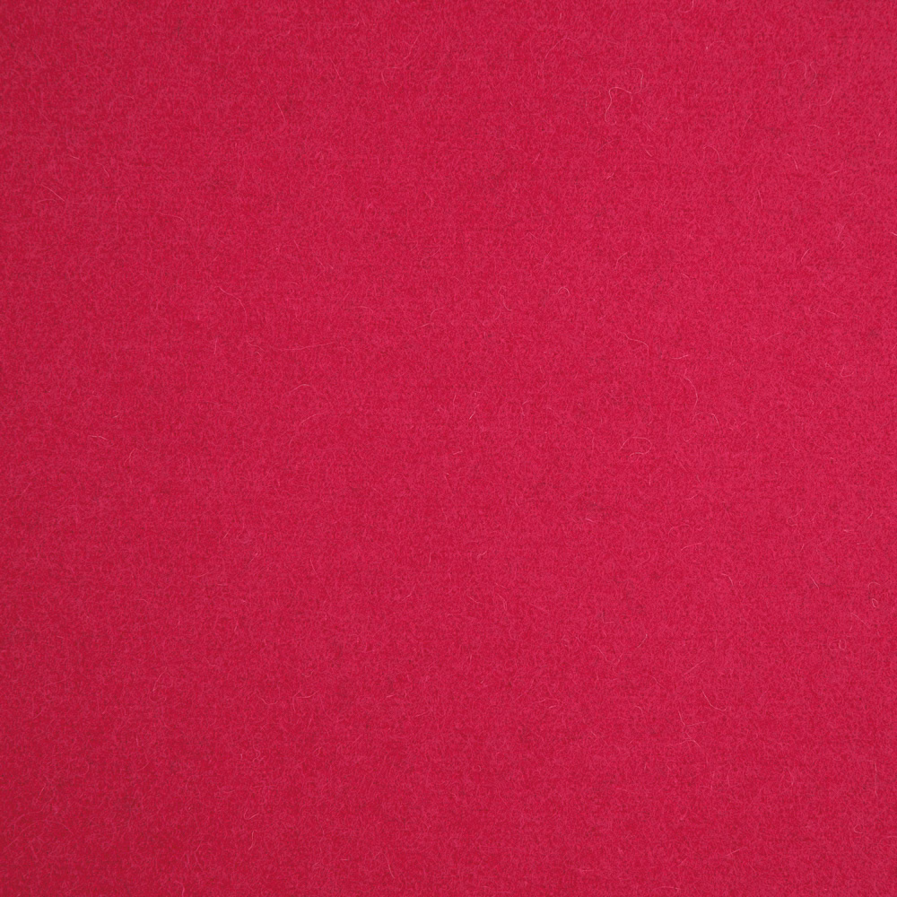 Close-up of vivid raspberry pink fabric with a softly brushed, subtly mottled surface