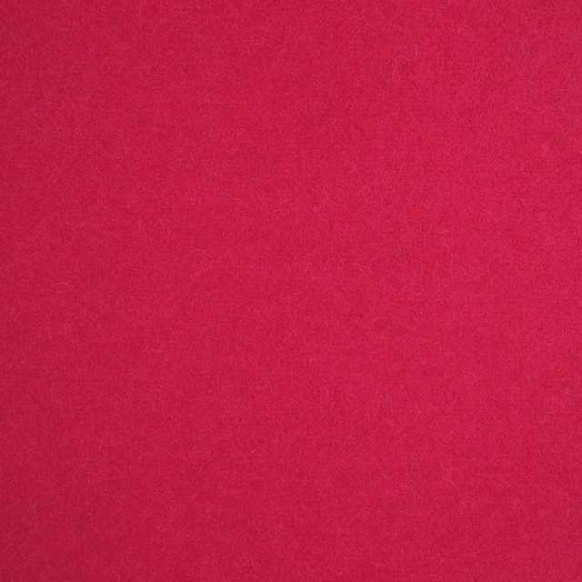 Close-up of vivid raspberry pink fabric with a softly brushed, subtly mottled surface