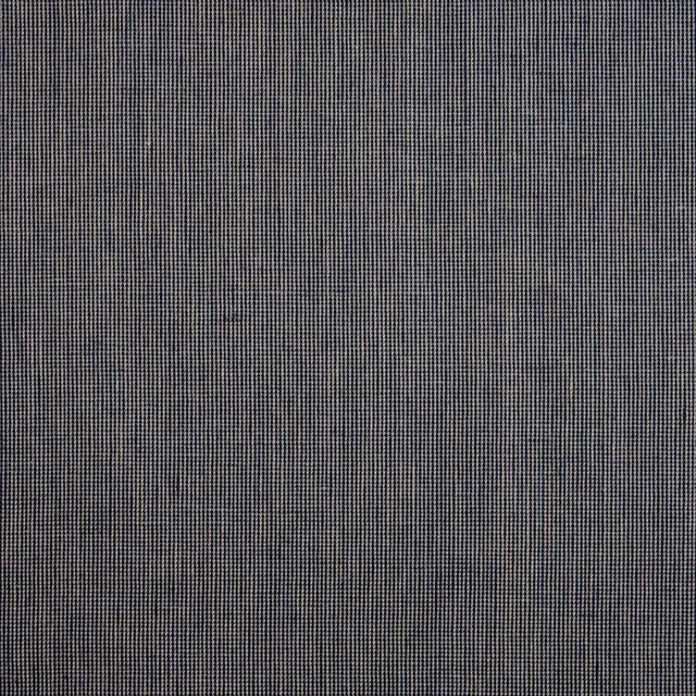 Charcoal-grey fabric with a fine black-and-grey micro-check woven texture