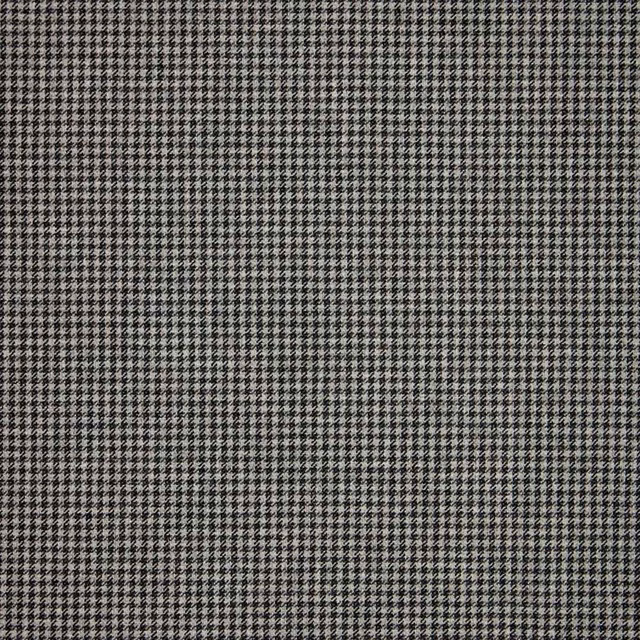 Charcoal and pale grey tightly woven micro houndstooth check fabric close-up