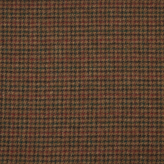 Close-up of brown woven check with muted rust, olive and charcoal flecks