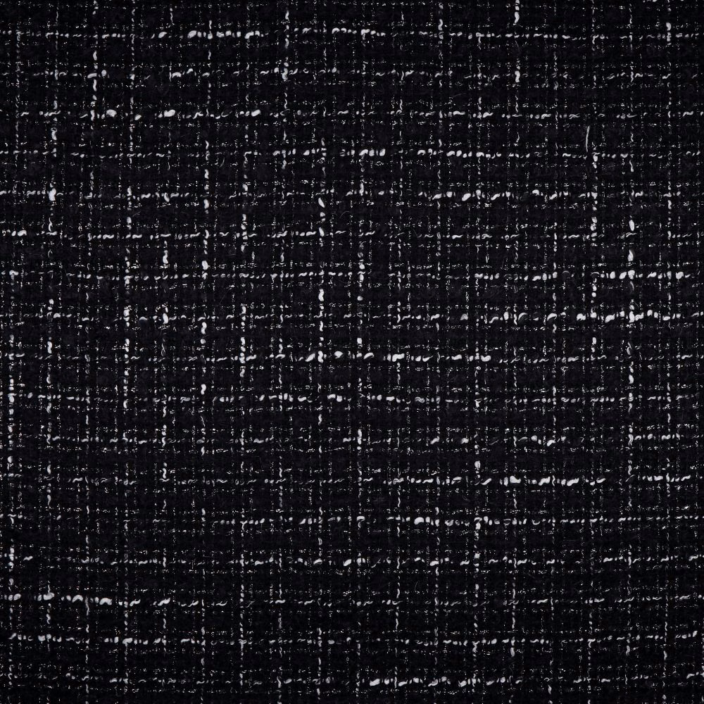 Near-black woven upholstery with irregular white flecks and crosshatch texture