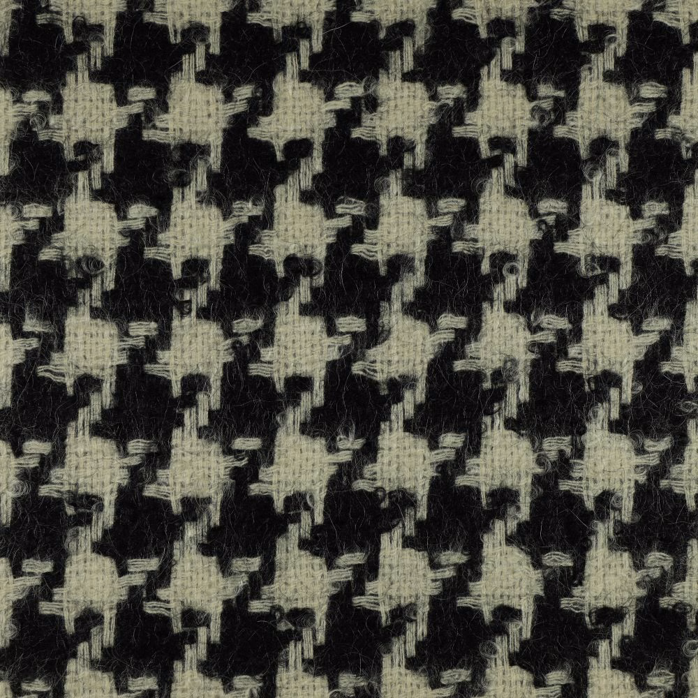 Charcoal black fabric with pale greige broken geometric motifs and fuzzy woven texture