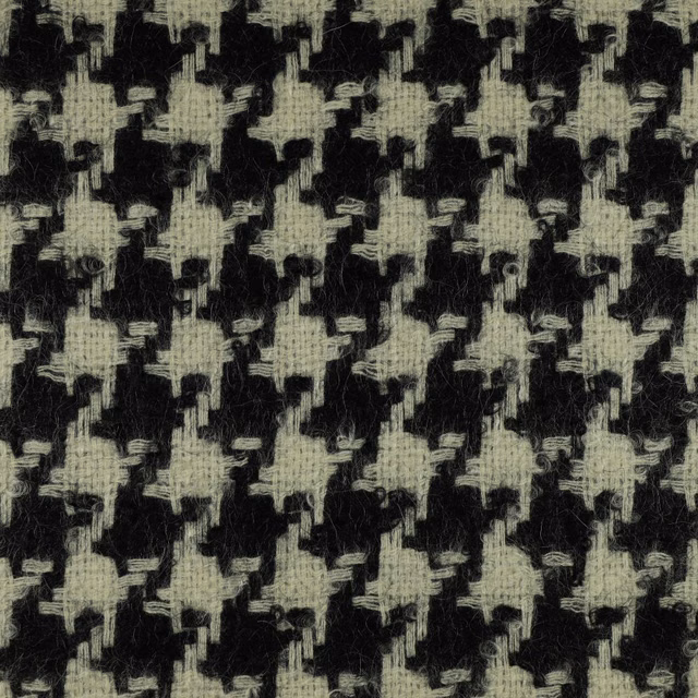 Charcoal black fabric with pale greige broken geometric motifs and fuzzy woven texture
