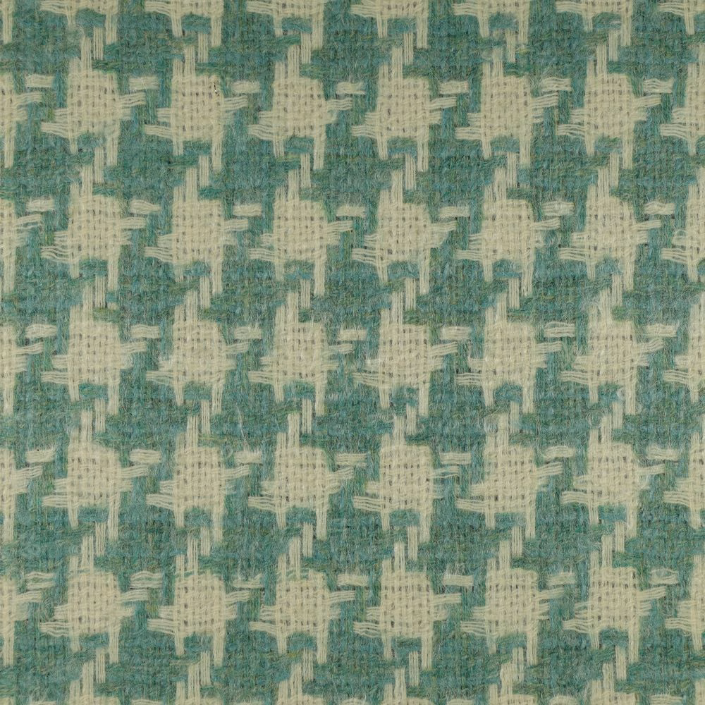 Muted teal fabric with ivory cross-like motifs and a nubby woven texture