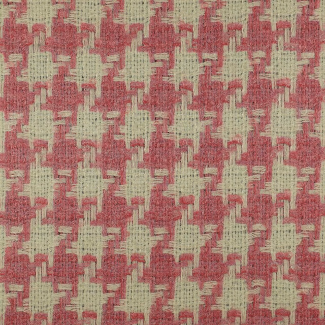 Dusty rose woven fabric with pale sage geometric flecks and a nubby surface