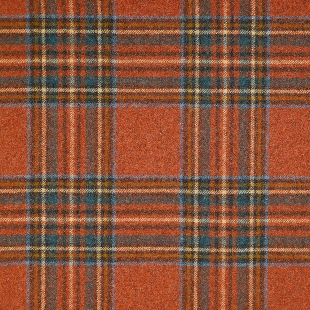 Rust terracotta tartan with teal, ochre and charcoal woven stripes and soft texture
