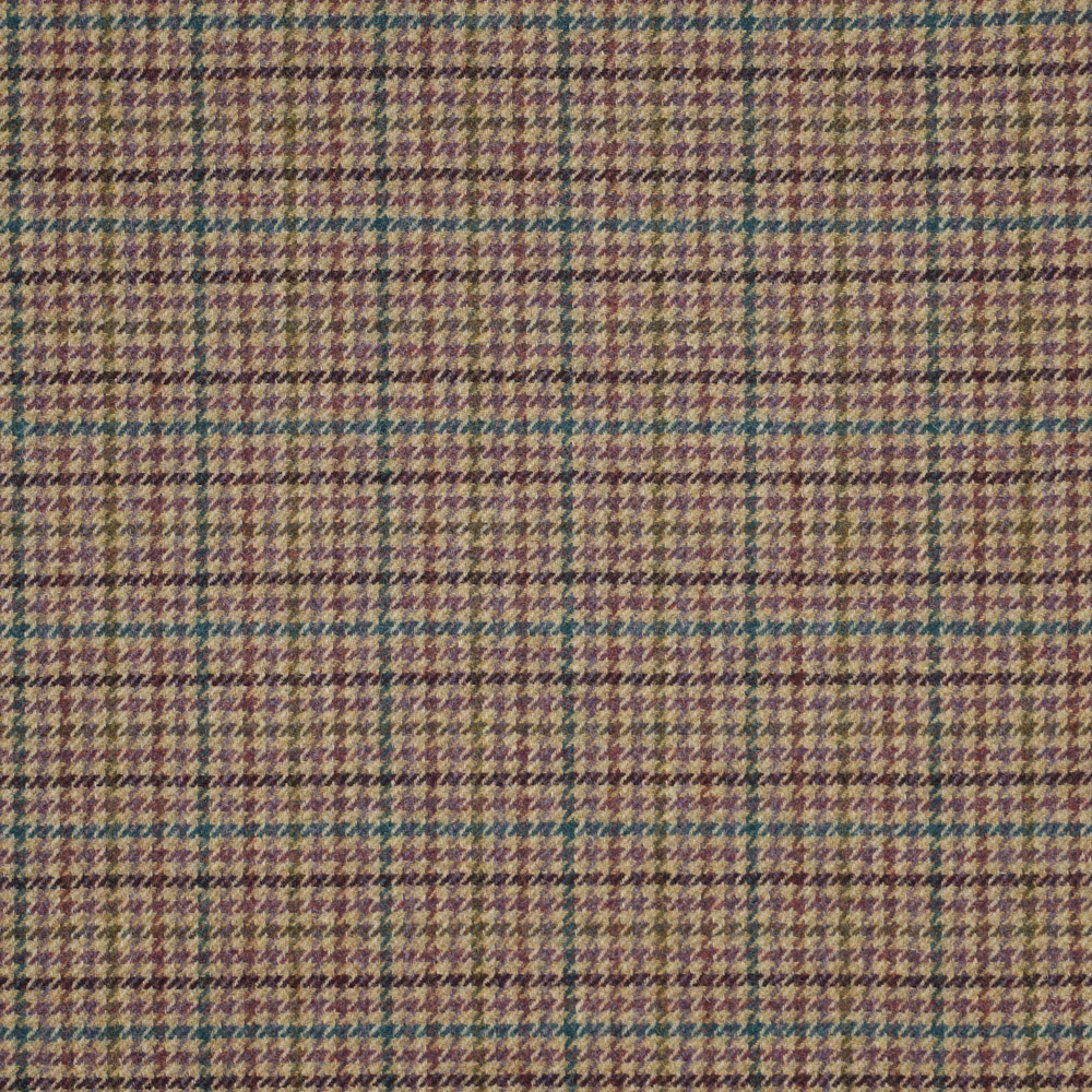 Close-up of muted lavender woven houndstooth with olive, teal and cream highlights