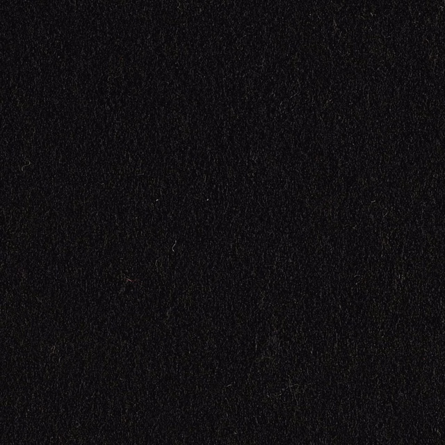 Close-up of deep black fabric with a softly napped, subtly textured surface