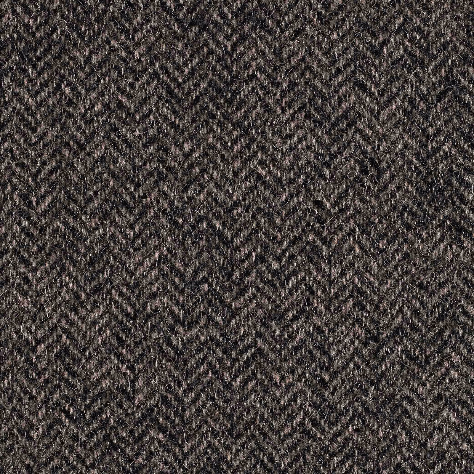 Close-up of black and white woven fabric with tiny broken zigzag texture