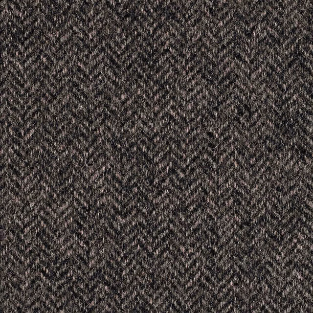 Close-up of black and white woven fabric with tiny broken zigzag texture