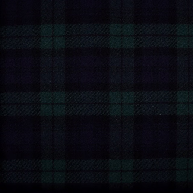Near-black and deep green woven fabric showing a large, subtle check pattern