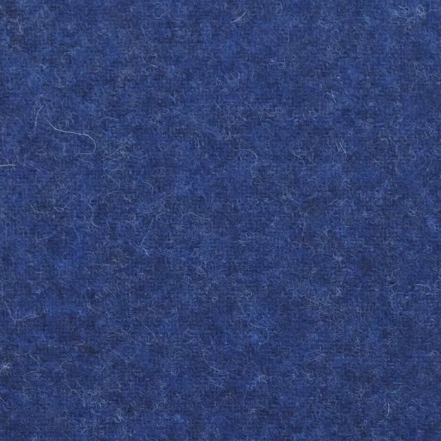 Close-up of deep cobalt blue fabric with a softly flecked, fibrous texture