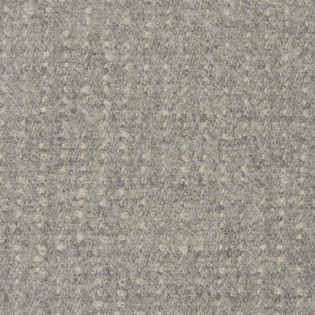 Warm stone-grey bouclé with beige flecks and dense, softly looped texture