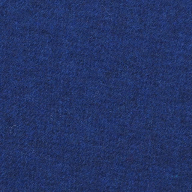 Deep cobalt blue textile with a dense, softly mottled woven texture