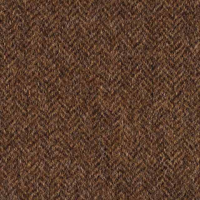 Close-up of dense nubby textile in warm camel brown with darker flecked fibres