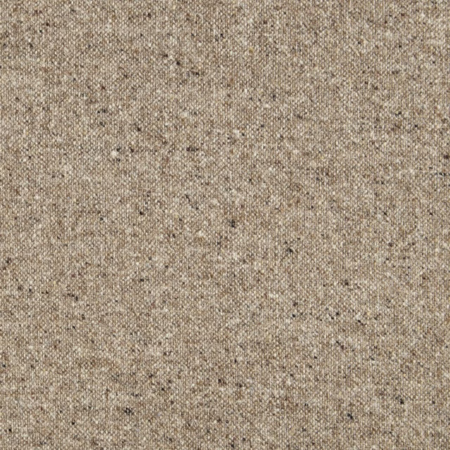 Warm camel beige woven fabric with nubby texture and scattered dark flecks