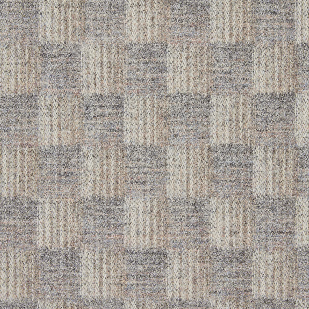 Close-up of taupe, stone and grey woven rectangular patchwork with nubby texture