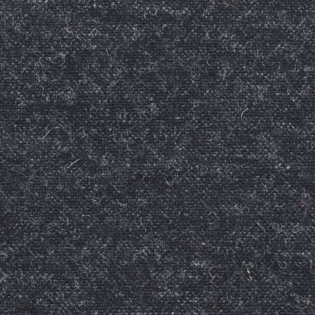 Dense charcoal grey textile with fine loops, flecks and softly curled fibres