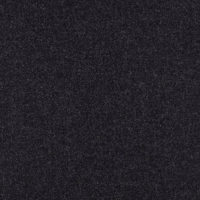 Close-up of dense charcoal grey fabric with a soft, mottled surface texture