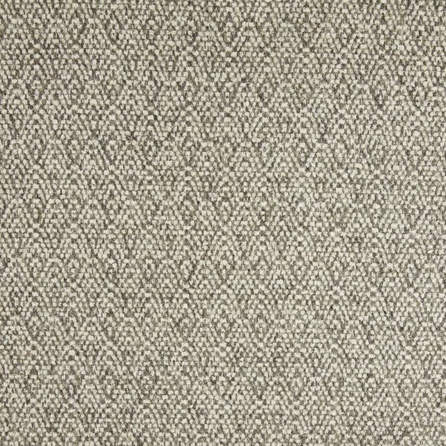 Close-up of mottled stone-beige fabric with fine grey flecks and irregular woven texture