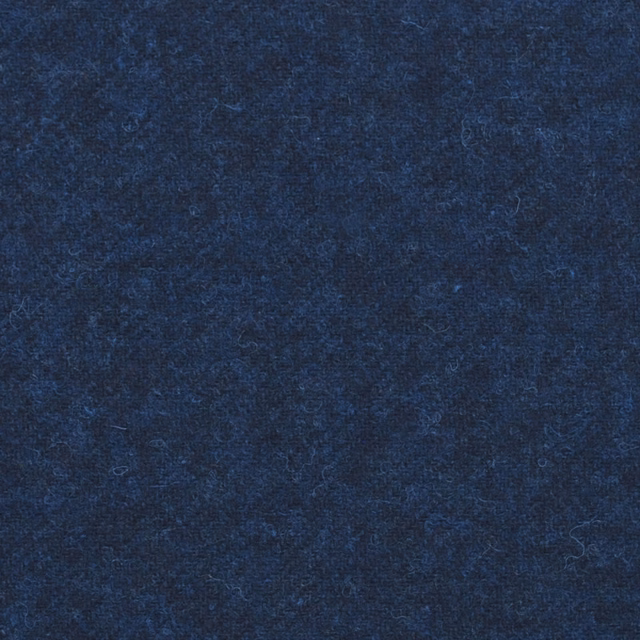 Deep navy blue fabric with softly mottled texture and subtle lighter-blue flecks