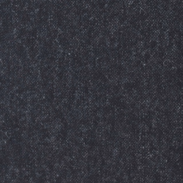 Close-up of dark charcoal woven textile with fine vertical striations and mottled flecks