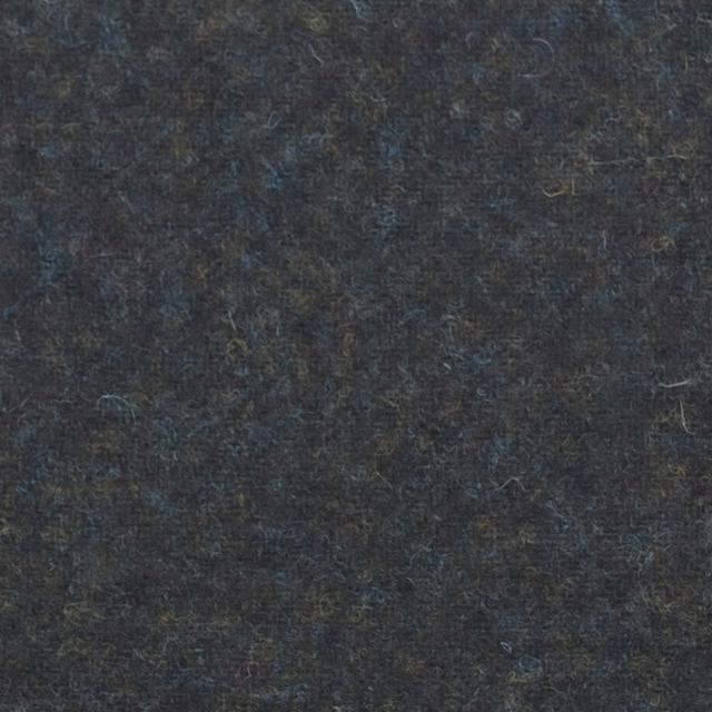 Dark forest-green fabric swatch with blue-charcoal flecks and a softly textured surface