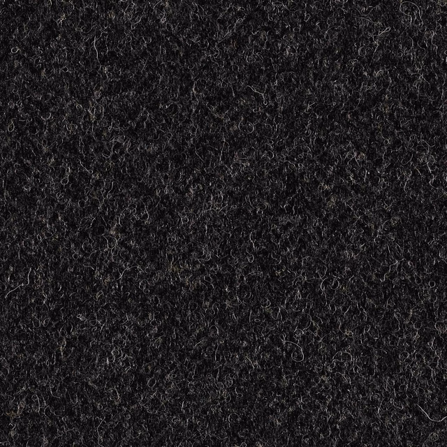 Close-up of dark charcoal grey fabric with dense curly fibres and subtle lighter strands