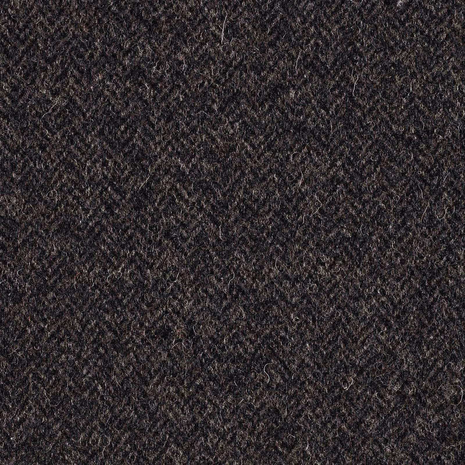 Deep charcoal grey textile with a nubby diagonal weave and softly mottled surface