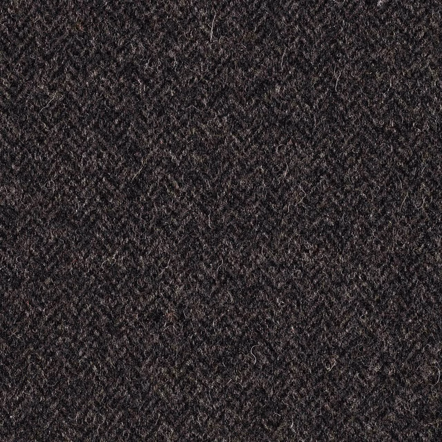 Deep charcoal grey textile with a nubby diagonal weave and softly mottled surface
