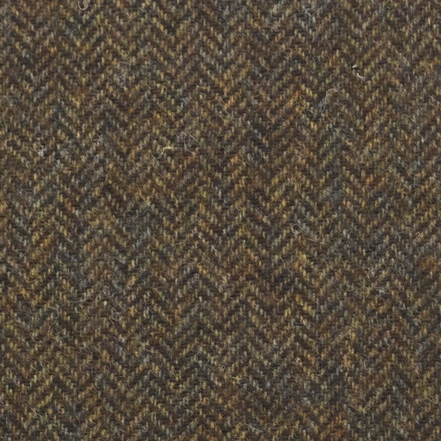 Deep olive-brown herringbone fabric with charcoal and tan flecks in a dense weave