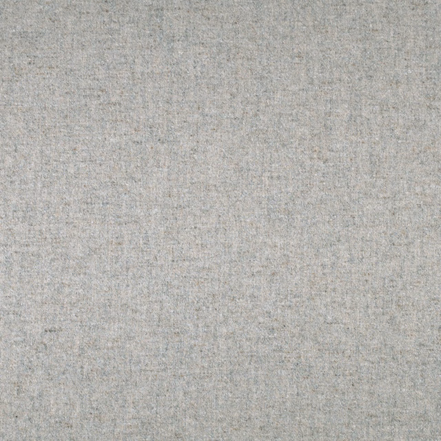 Close view of softly mottled dove-grey fabric with fine weave and beige flecks