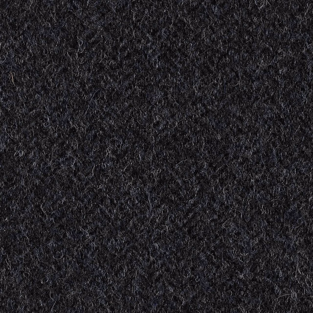 Near-black charcoal fabric with dense curly loops and blue-grey flecks