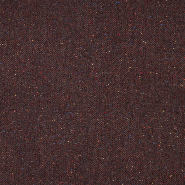 Dark burgundy woven textile with tiny red, blue and ochre flecks