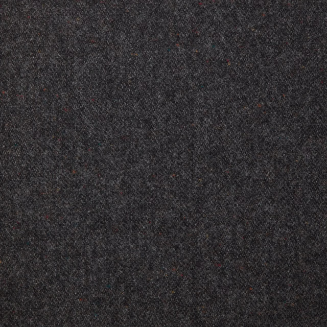 Close-up of dark charcoal fabric with dense mottled weave and subtle coloured flecks
