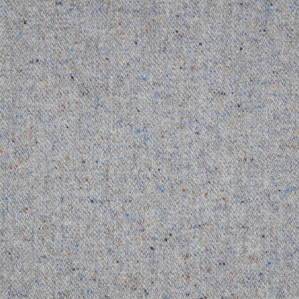 Close view of muted denim blue-grey weave with cream, tan and dark flecks