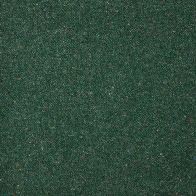 Close-up of dense emerald green weave with subtle teal, brown and red flecks