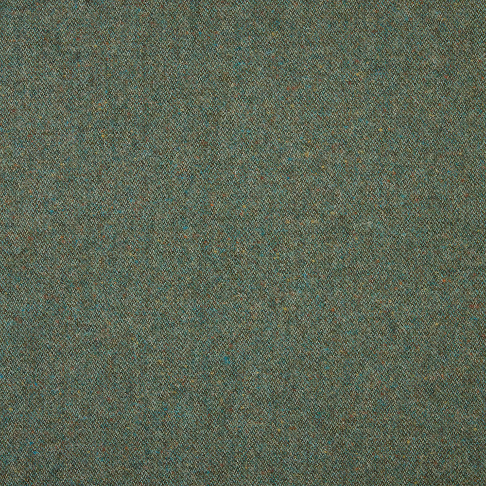 Dense evergreen weave with teal and warm brown flecks in close view