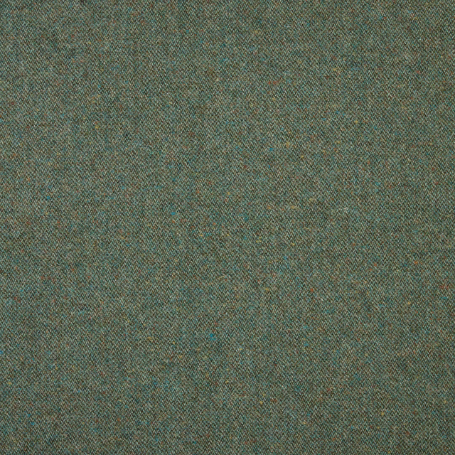 Dense evergreen weave with teal and warm brown flecks in close view