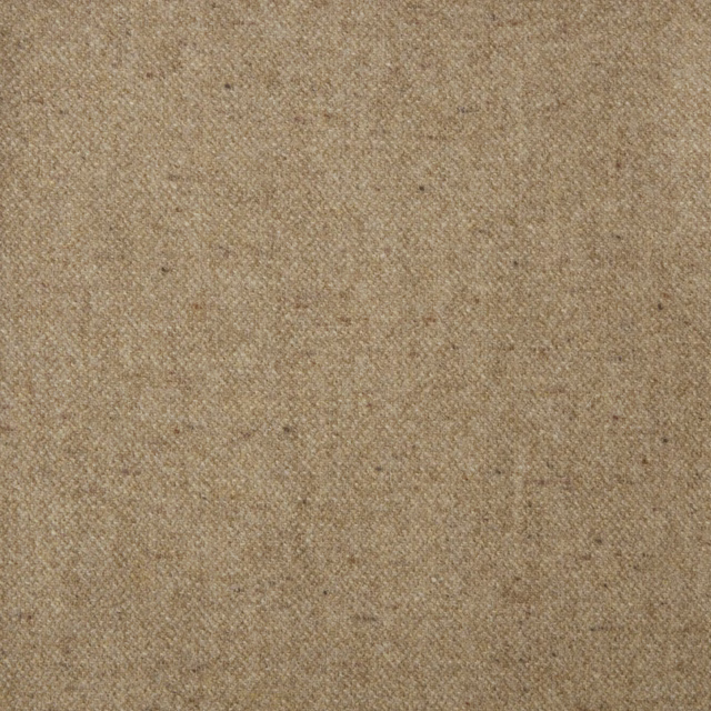Close-up of Donegal Honey's warm honey-beige flecked weave with subtle diagonal texture